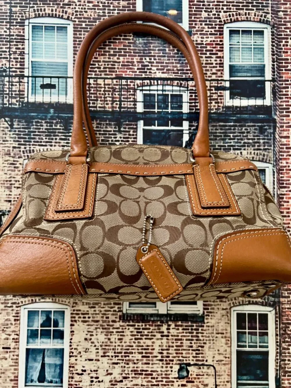 Coach signature monogram canvas satchel handbag with tan leather trim and dual